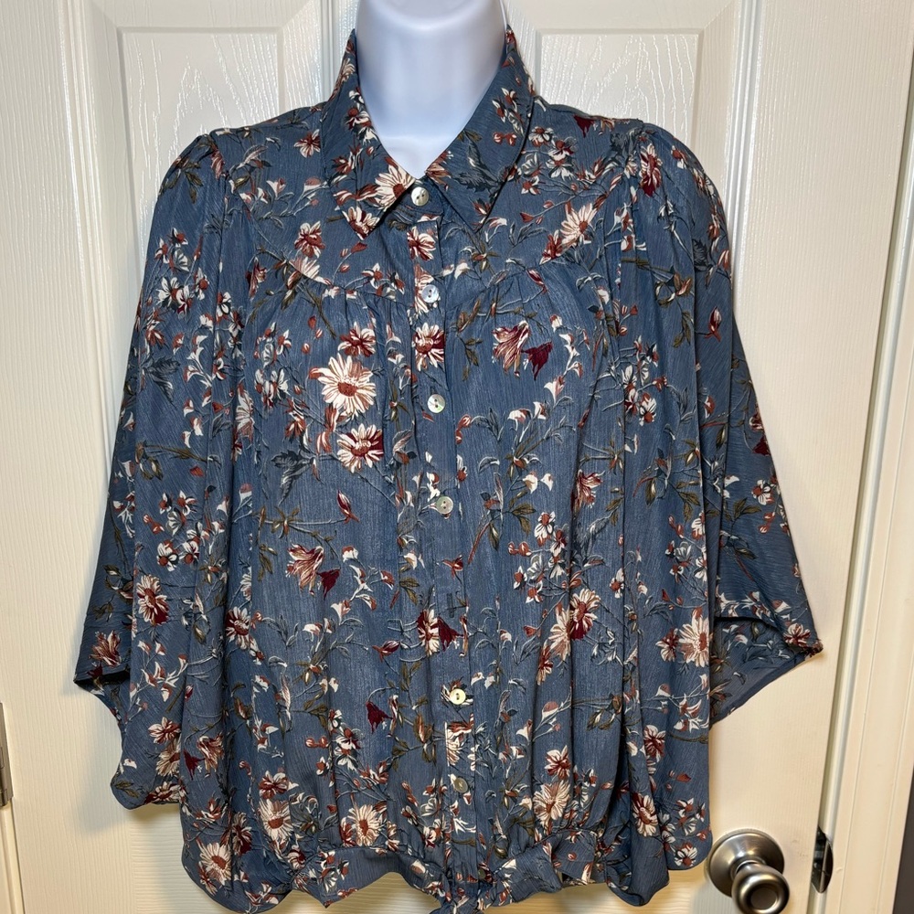 Easel blue floral blouse with tie front and large flowing sleeves .Size small